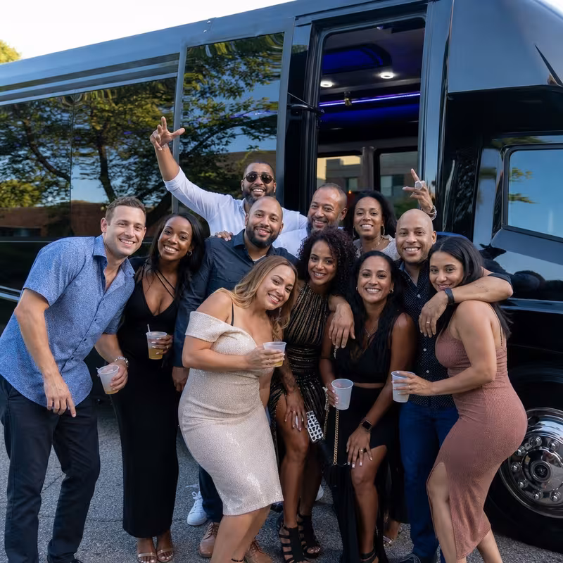 Party bus interior with wraparound leather seating and LED lighting in Miami