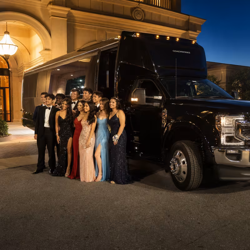 Party bus interior with wraparound leather seating and LED lighting in Miami