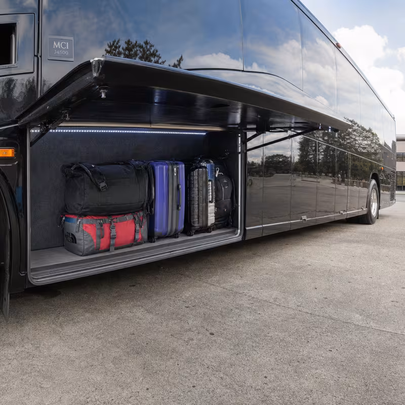 Party bus interior with wraparound leather seating and LED lighting in Miami