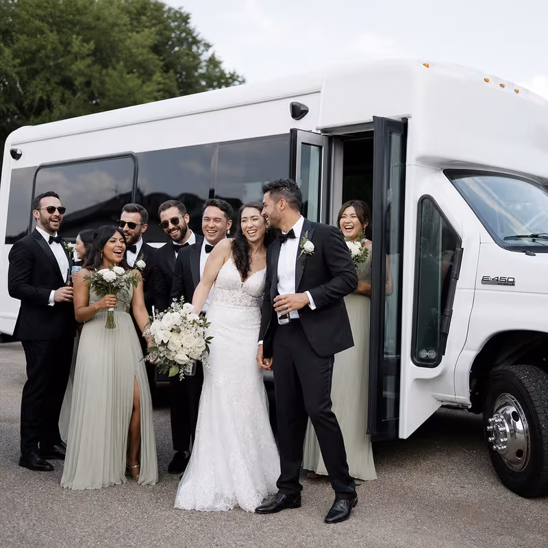 Passengers loading luggage while boarding a Miami group shuttle