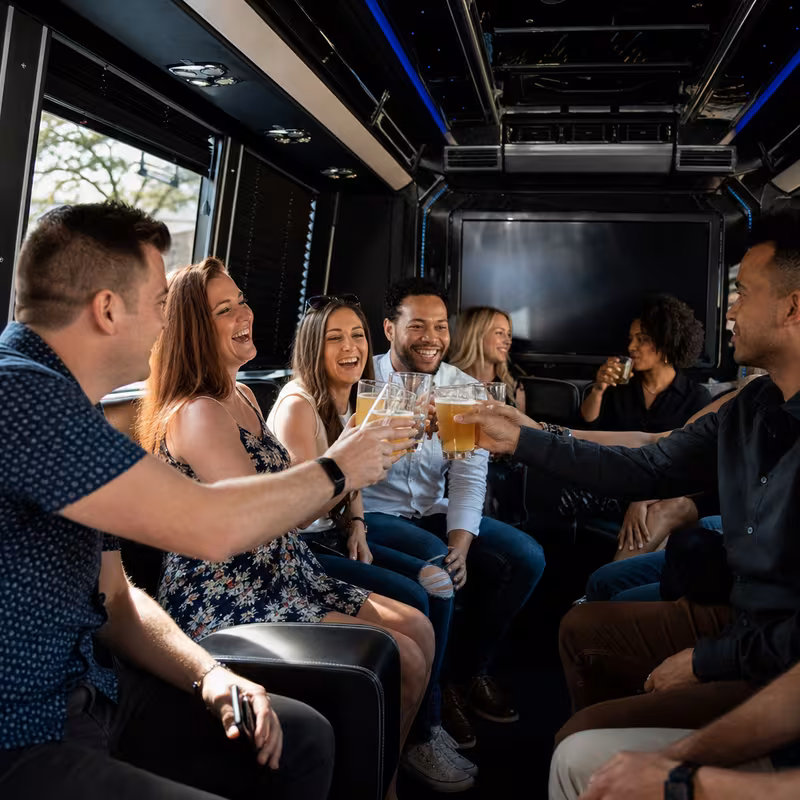 Group boarding a white charter bus for Winery & Brewery Tour Transportation transportation in Miami