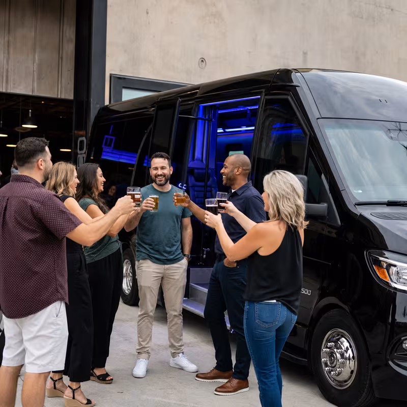 Passengers loading luggage while boarding a Miami group shuttle